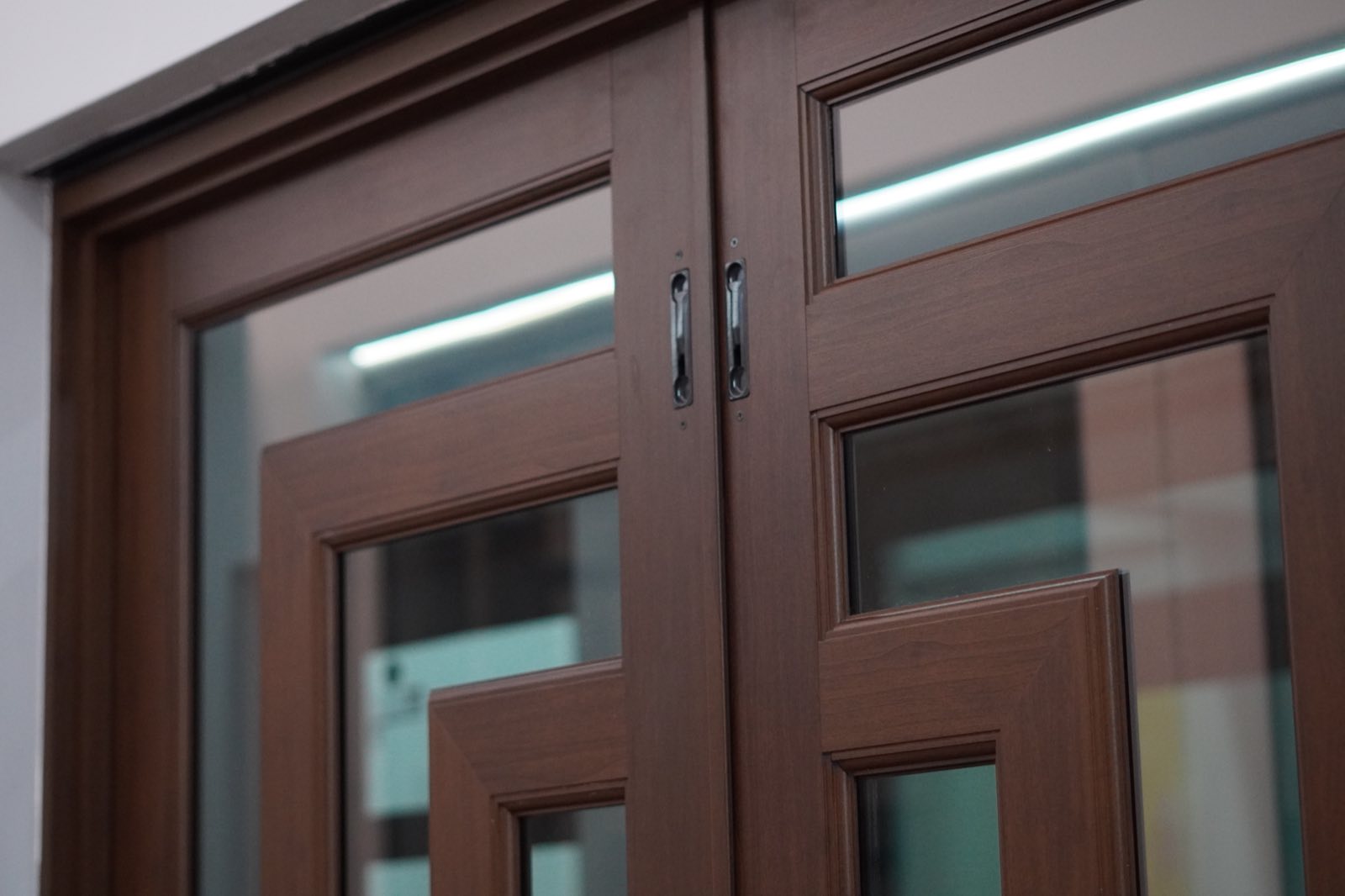 Wood-finish impact French doors seen up close