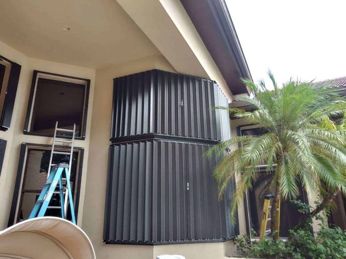 Accordion shutters installed on a corner