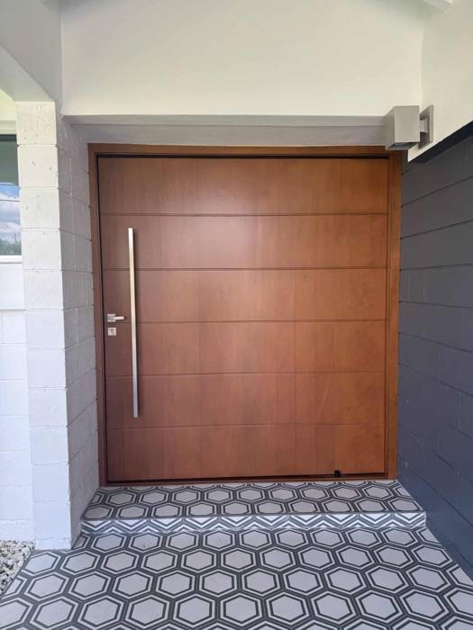 Wood pivot impact door
