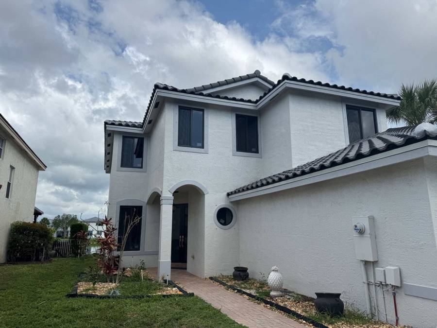 Two-story home with black-frame windows